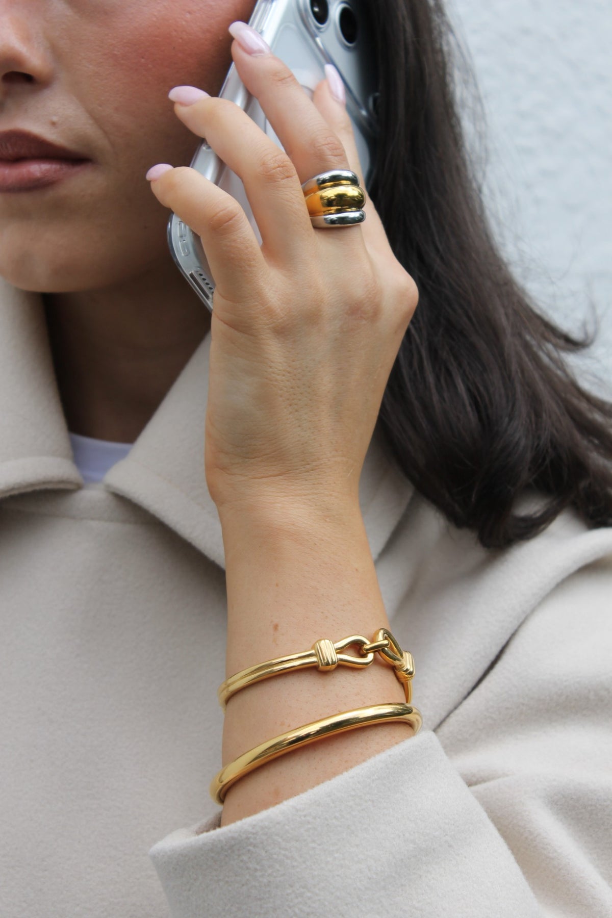 Two-Tone Ribbed Ring and two gold bangles, hand raised (placeholder for The Wrist Stack)